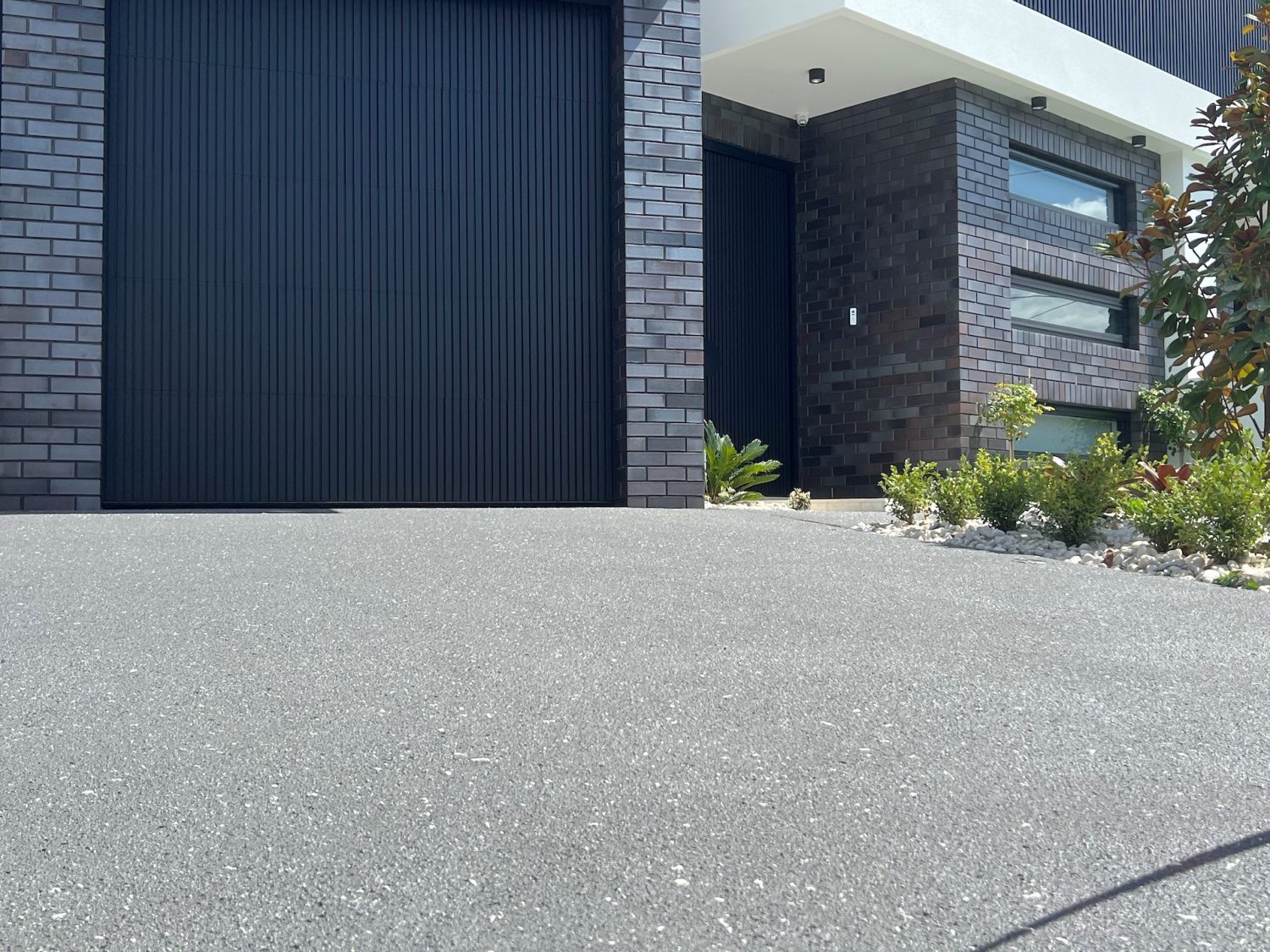 Concrete resurfacing in Steel grey base with white and black fleck, driveway resurfacing at a home in Chester Hill, Sydney