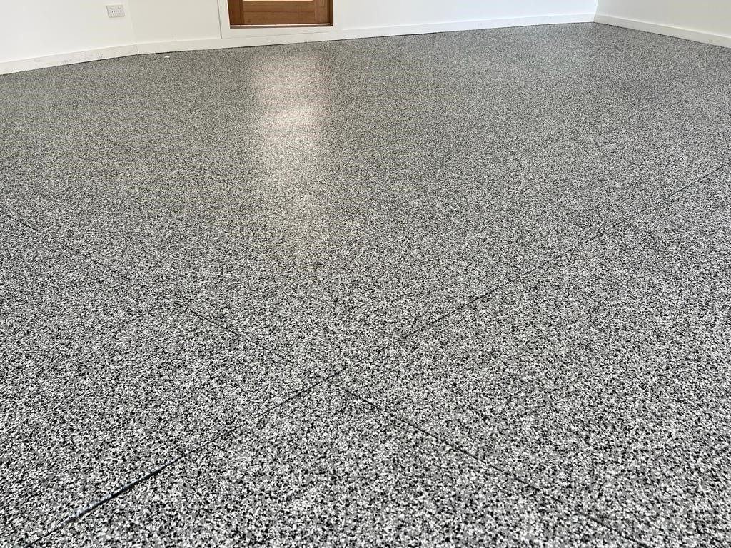 Garage floor finished in cookies and cream epoxy flake at a home in St Clair, Sydney